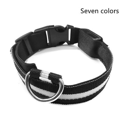 Black webbing collar with a grey stripe, black side-release buckle and silver-coloured D-ring, captioned Seven colors in the corner of the photograph